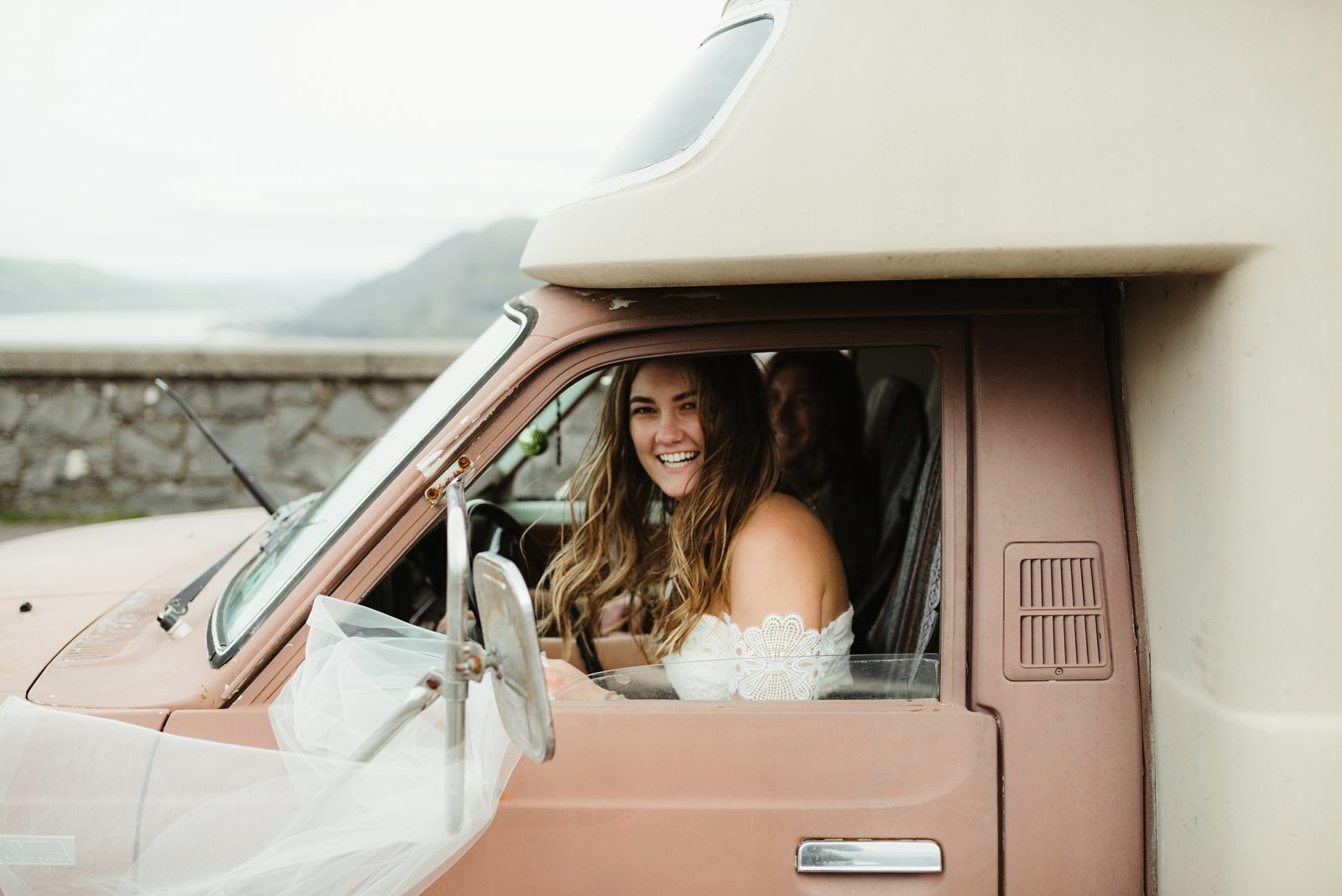 Bohemian bride in her camper after eloping on a roadtrip