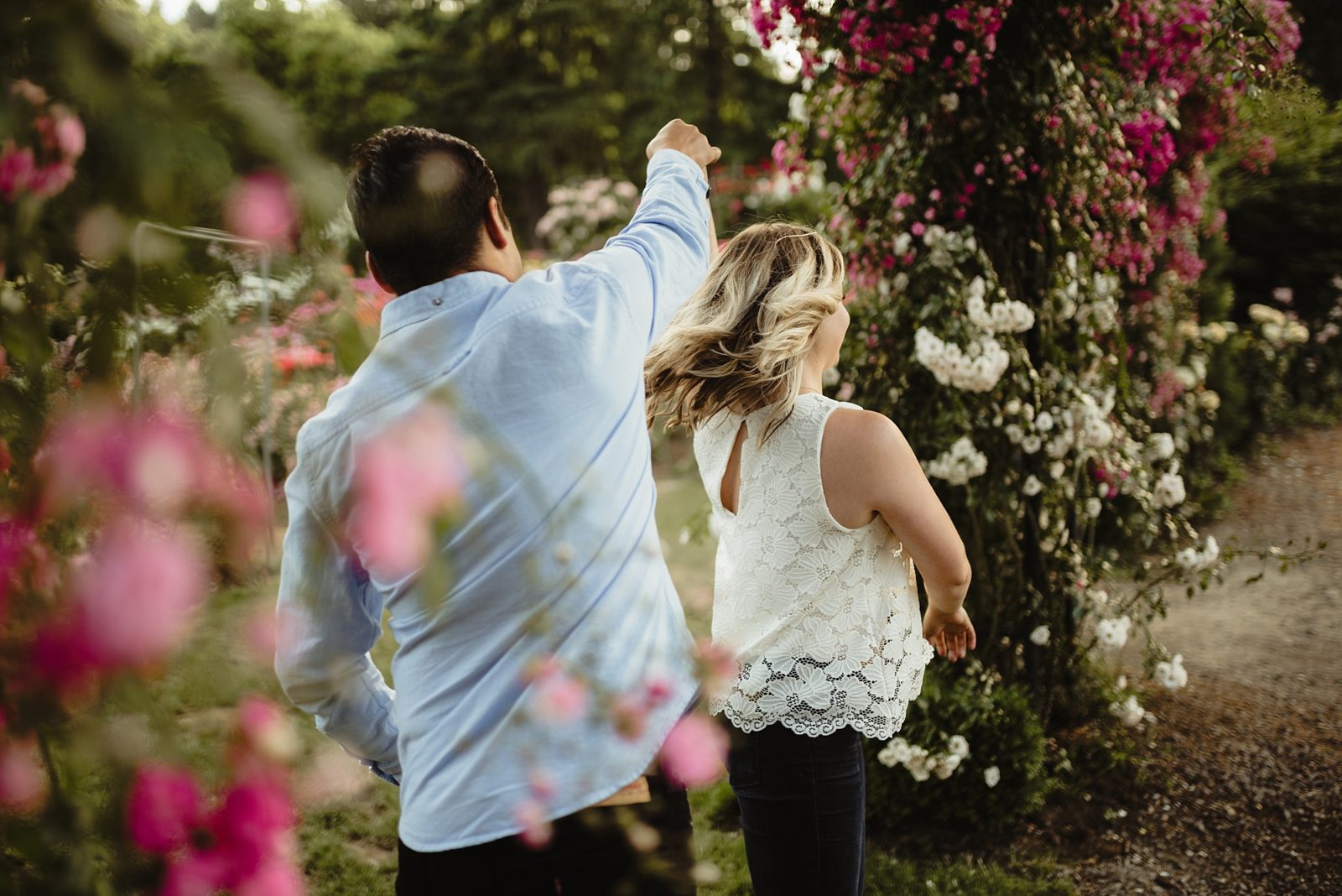 Couple dancing in the Rose Garden of Portland, Oregon during their engagement photos.